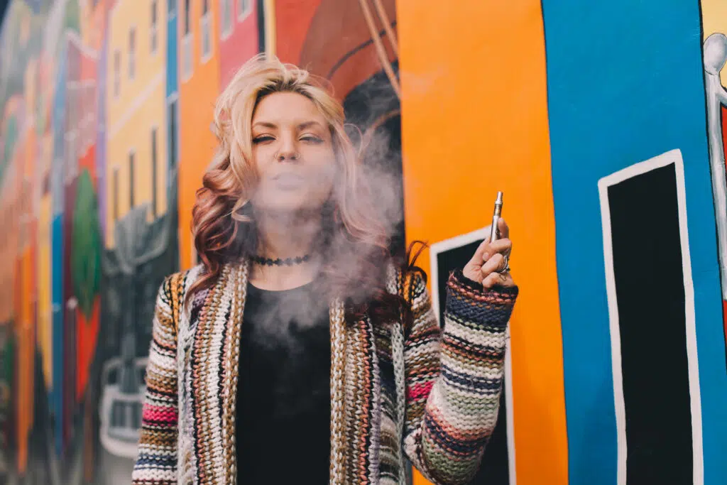 blonde woman smokes cannabis